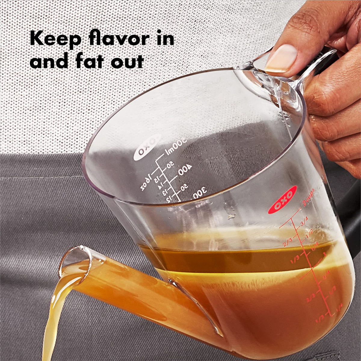 OXO fat separator strainer captures solids for cleaner drippings
