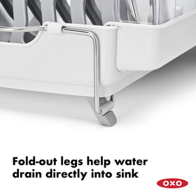 OXO Good Grips Foldaway Dish Rack cup racks cradle mugs to prevent drips.