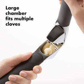 OXO Good Grips Garlic Press features built-in cleaner for easy peel removal.