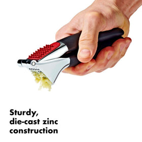 OXO Good Grips Garlic Press with large die-cast zinc chamber for multiple cloves.