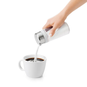 OXO Good Grips glass sugar dispenser 12oz capacity on the counter.