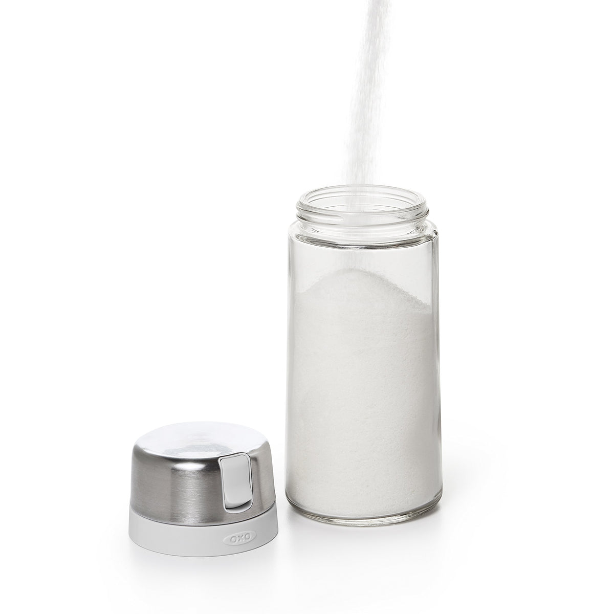 OXO Good Grips glass sugar dispenser clean, sleek glass body for modern kitchens.