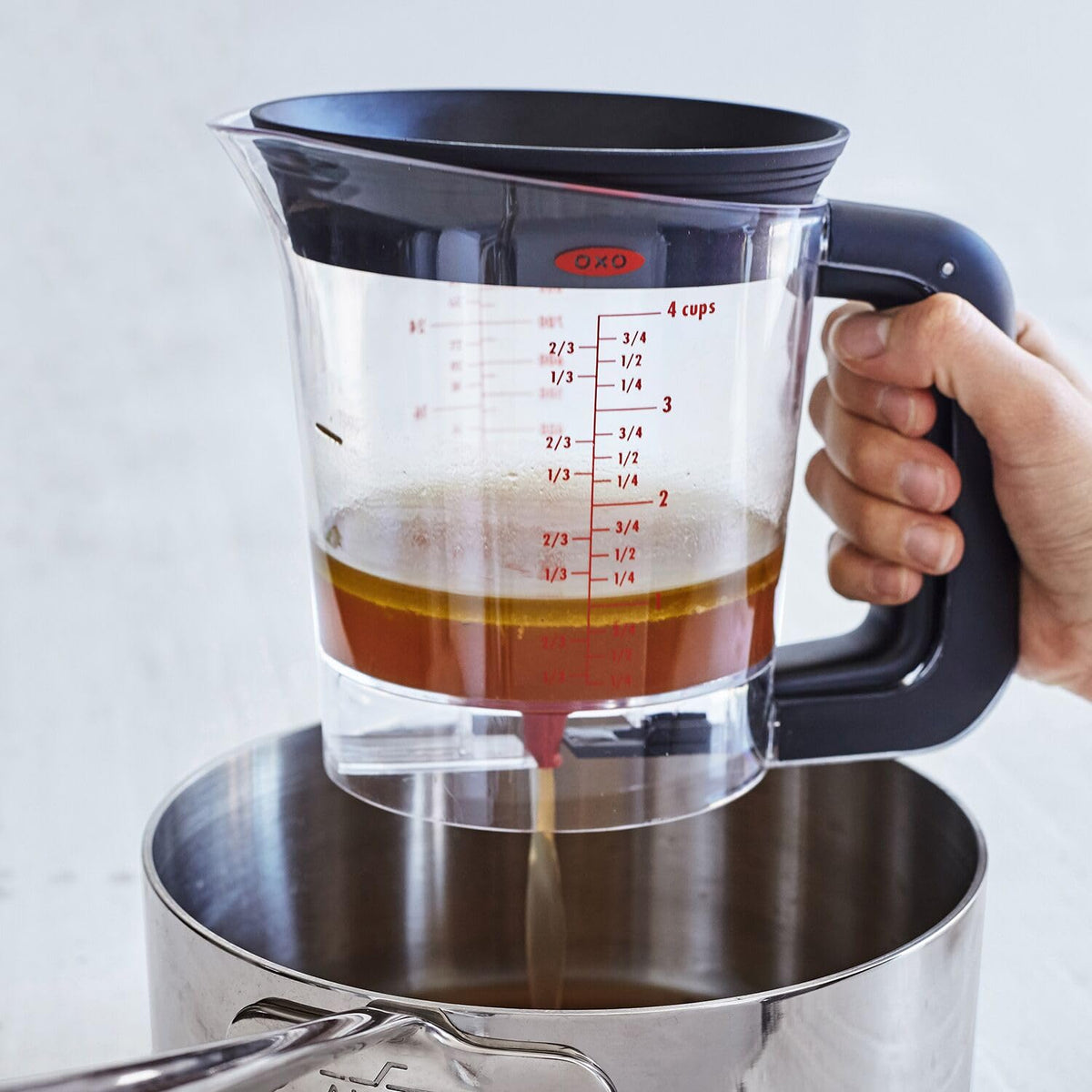 OXO Good Grips Fat Separator with external drain for quick cleanup after cooking.