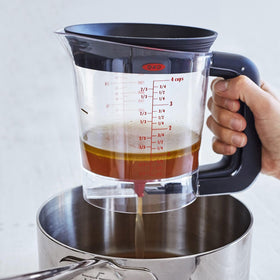 OXO Good Grips Fat Separator with external drain for quick cleanup after cooking.