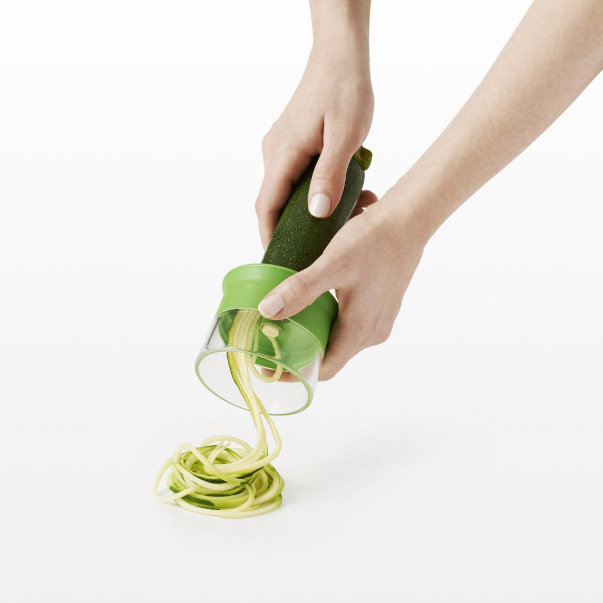 OXO Good Grips spiralizer food holder supports hands and doubles as storage cap.
