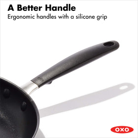OXO Good Grips pan handle close-up with stay cool silicone grip.