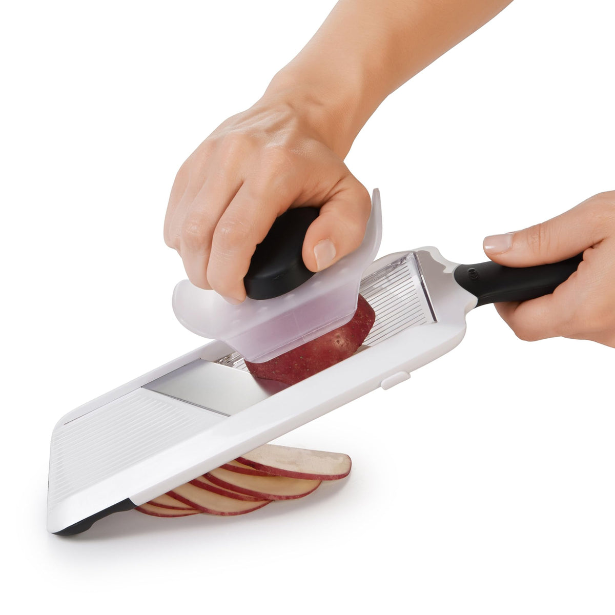 OXO Good Grips slicer features a stable foot for secure vegetable slicing.