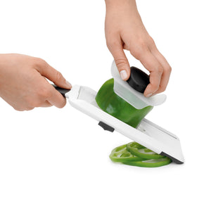 OXO mandoline's stable foot supports safe, steady cutting.