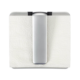 OXO Good Grips napkin holder with weighted arm keeps napkins secure on the counter.