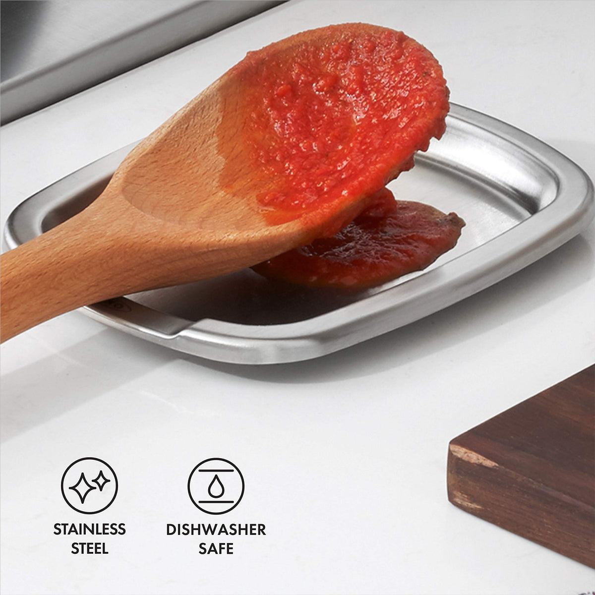 Spoon rest used sideways to hold multiple utensils at once