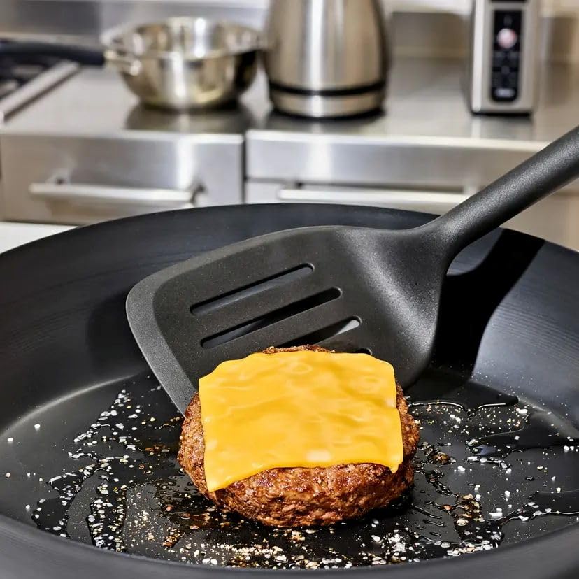 OXO nylon slotted turner safely glides under food on nonstick pans.