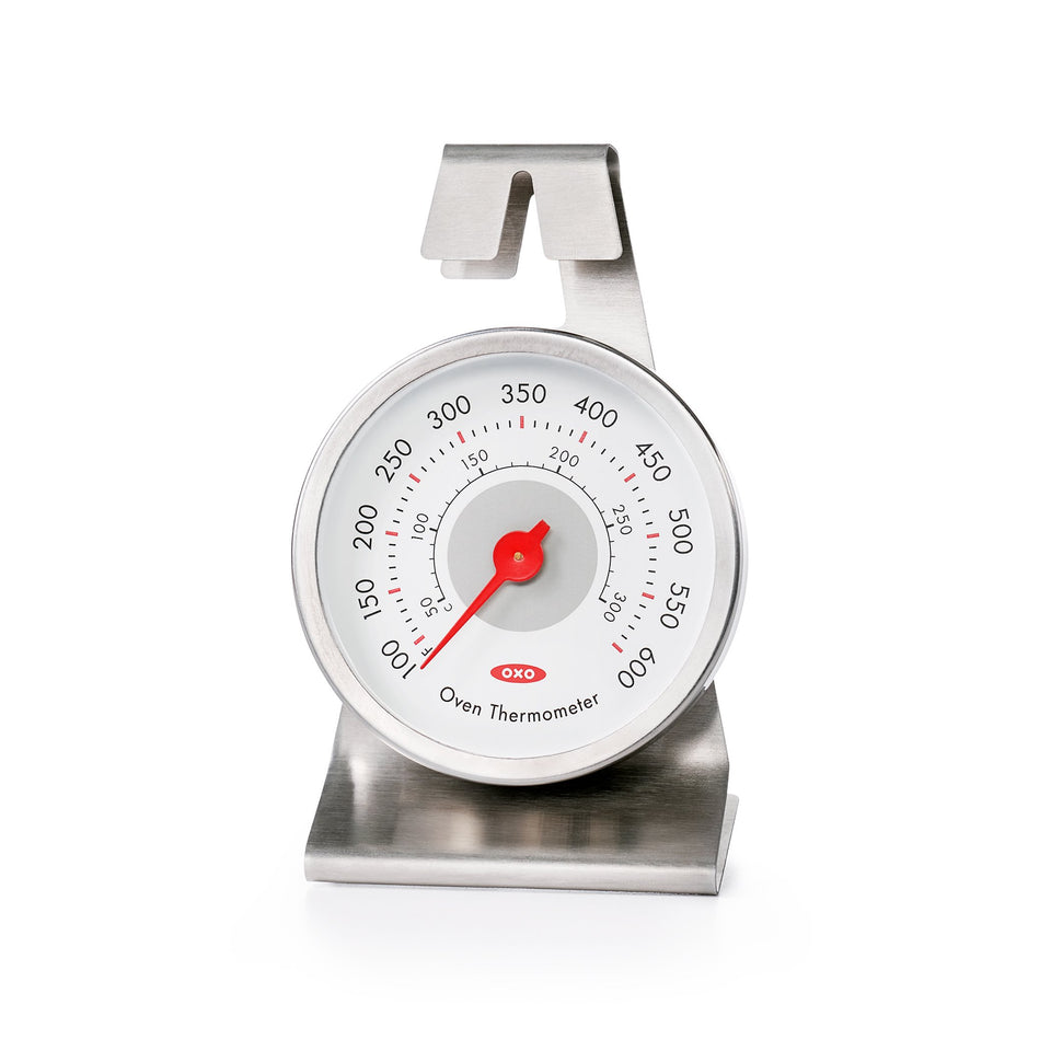 OXO Good Grips Oven Thermometer clipped securely to rack for precise readings.