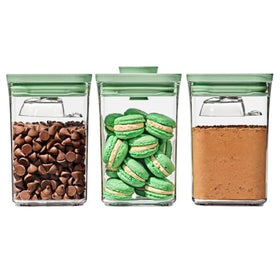 OXO Good Grips POP containers with pistachio lids for organized pantry storage.