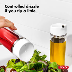 OXO Good Grips lid being removed for easy cleaning.