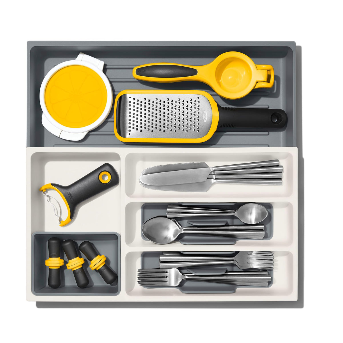 Removable cup stores wine stoppers and small gadgets to reduce clutter.