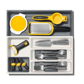Removable cup stores wine stoppers and small gadgets to reduce clutter.