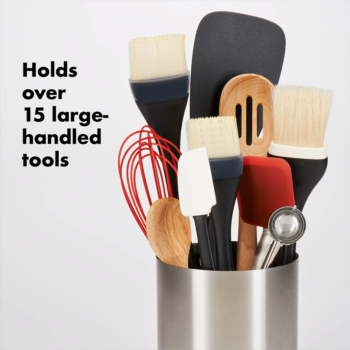 OXO Good Grips rotating utensil holder with three compartments keeps utensils organized.