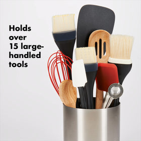 OXO Good Grips rotating utensil holder with three compartments keeps utensils organized.