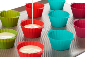 OXO Good Grips silicone baking cups showing batter fill line for equal-sized treats.