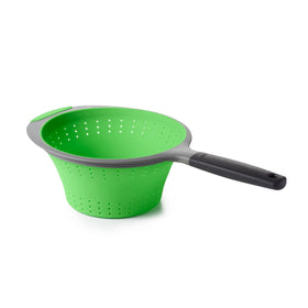 OXO Good Grips silicone collapsible strainer in green, top view for quick draining