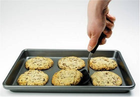 OXO Good Grips silicone layer close-up shows durable silicone bonded to stainless steel.