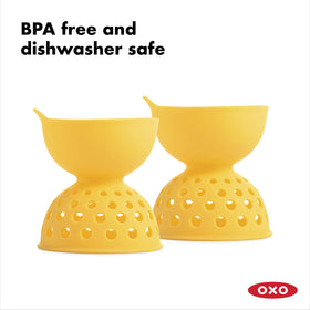 OXO Good Grips silicone egg poacher held over pot of simmering water