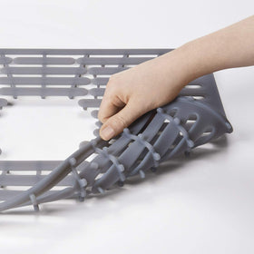 OXO Good Grips mat features cut-hole pattern for flexible drain customization