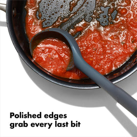 OXO Good Grips silicone utensil handle close-up highlighting non-slip comfort.