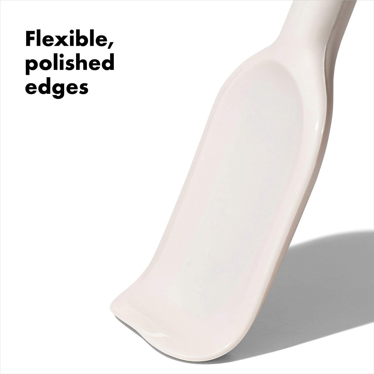 OXO small spatula in use with a saucepan for precise scraping.