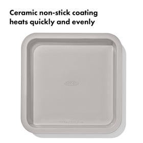 OXO Good Grips square rolled-edge cake pan, angle shows structure and durability.