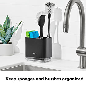 OXO Good Grips sink caddy interior shows divider for ventilation and fast-drying tools.