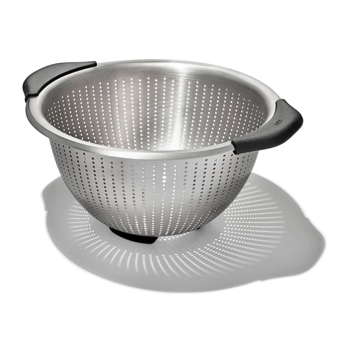 OXO Good Grips colander with non-slip handles for safe pasta draining.