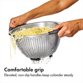 OXO Good Grips colander showing perforated surface for fast drainage.