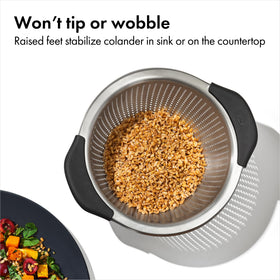 OXO Good Grips colander with three raised feet for stable rinsing.