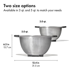 OXO Good Grips colander rinsing vegetables with sturdy build.