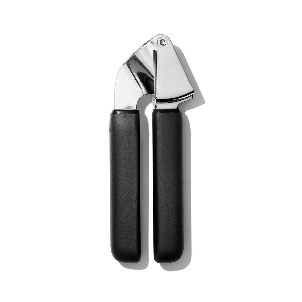 OXO Good Grips stainless steel garlic press with ergonomic handle for effortless crushing.