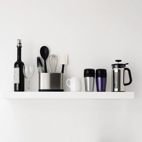 Locking tab on OXO tongs for compact storage