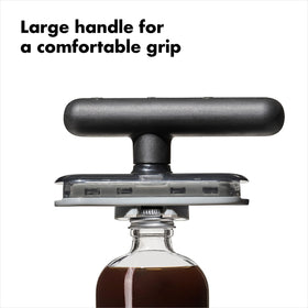 OXO Good Grips Twisting Jar Opener ready to open vanilla bottles with a secure grip.