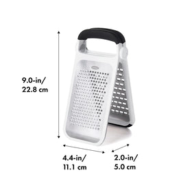 OXO Good Grips Two-Fold Etched Grater over a cutting board for flexible use