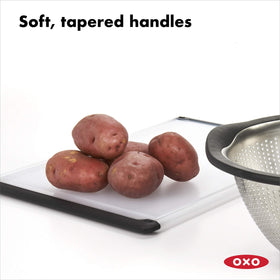 OXO Good Grips Utility Cutting Board, non-slip feet keep it steady during chopping.