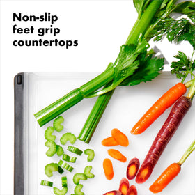 OXO Good Grips Utility Cutting Board, soft tapered edges for comfortable lifting and carrying.
