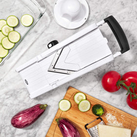 OXO Good Grips V-Blade Mandoline Slicer with straight, wavy, and julienne blades for versatile veggie prep.