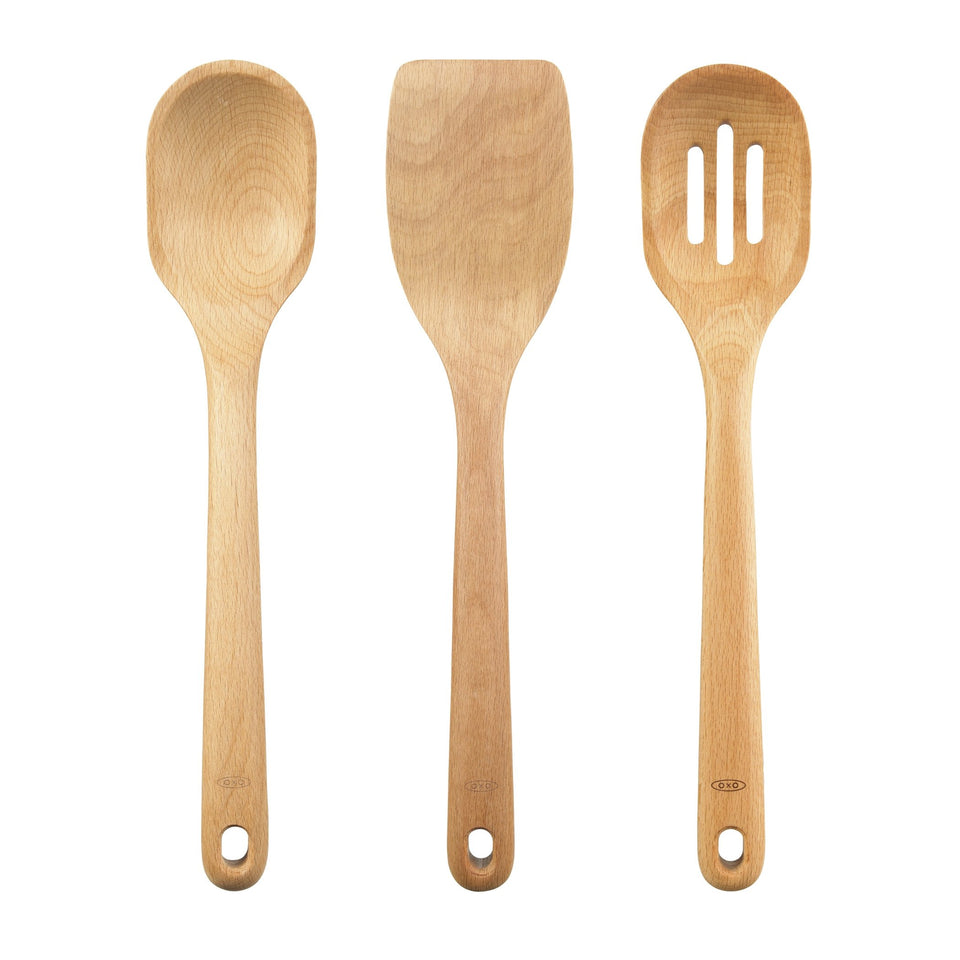 OXO Good Grips wooden spoon on beechwood, ideal for stirring and serving.