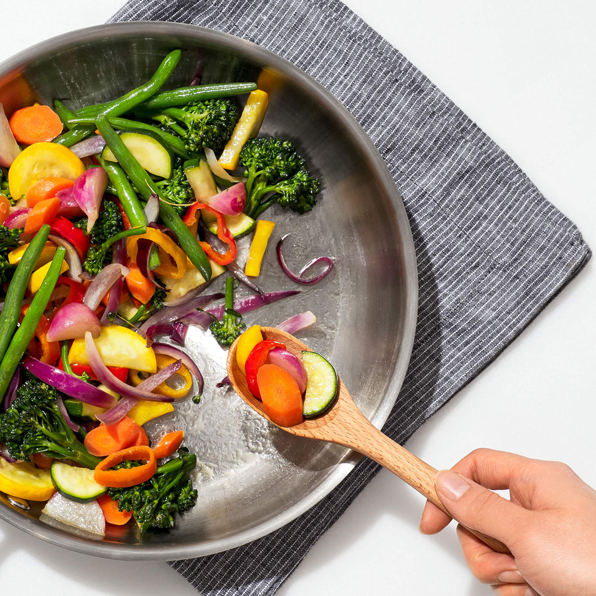 OXO Good Grips turner handling turning tasks in non-stick pans.