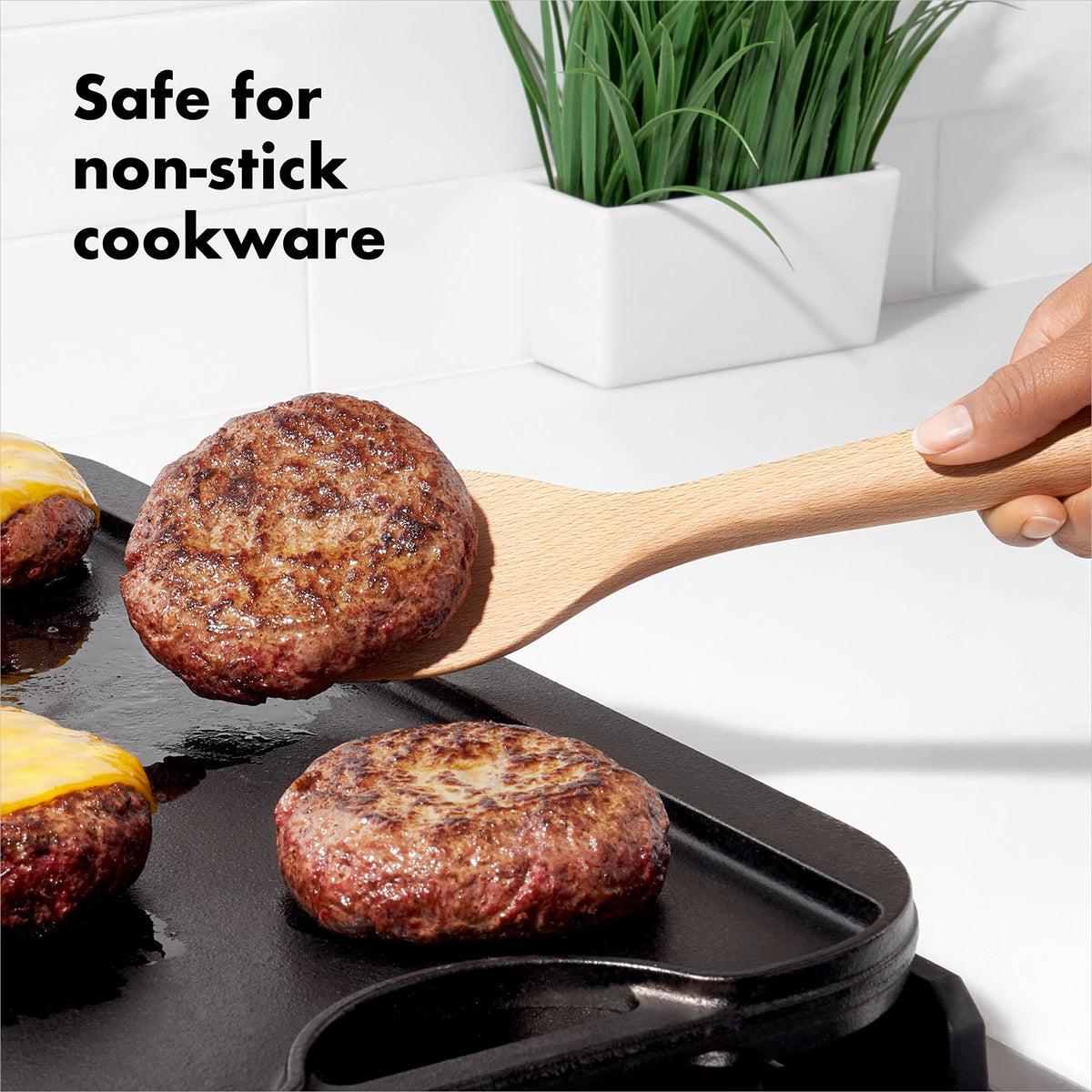 Close-up of OXO Good Grips wooden spoon with comfortable handle.