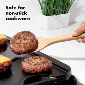 Close-up of OXO Good Grips wooden spoon with comfortable handle.