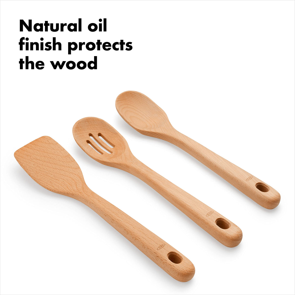 Wooden utensils shown near a nonstick pan, safe for cookware.