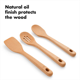 Wooden utensils shown near a nonstick pan, safe for cookware.