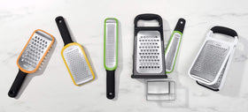 OXO Good Grips grating zucchini and onions with ease