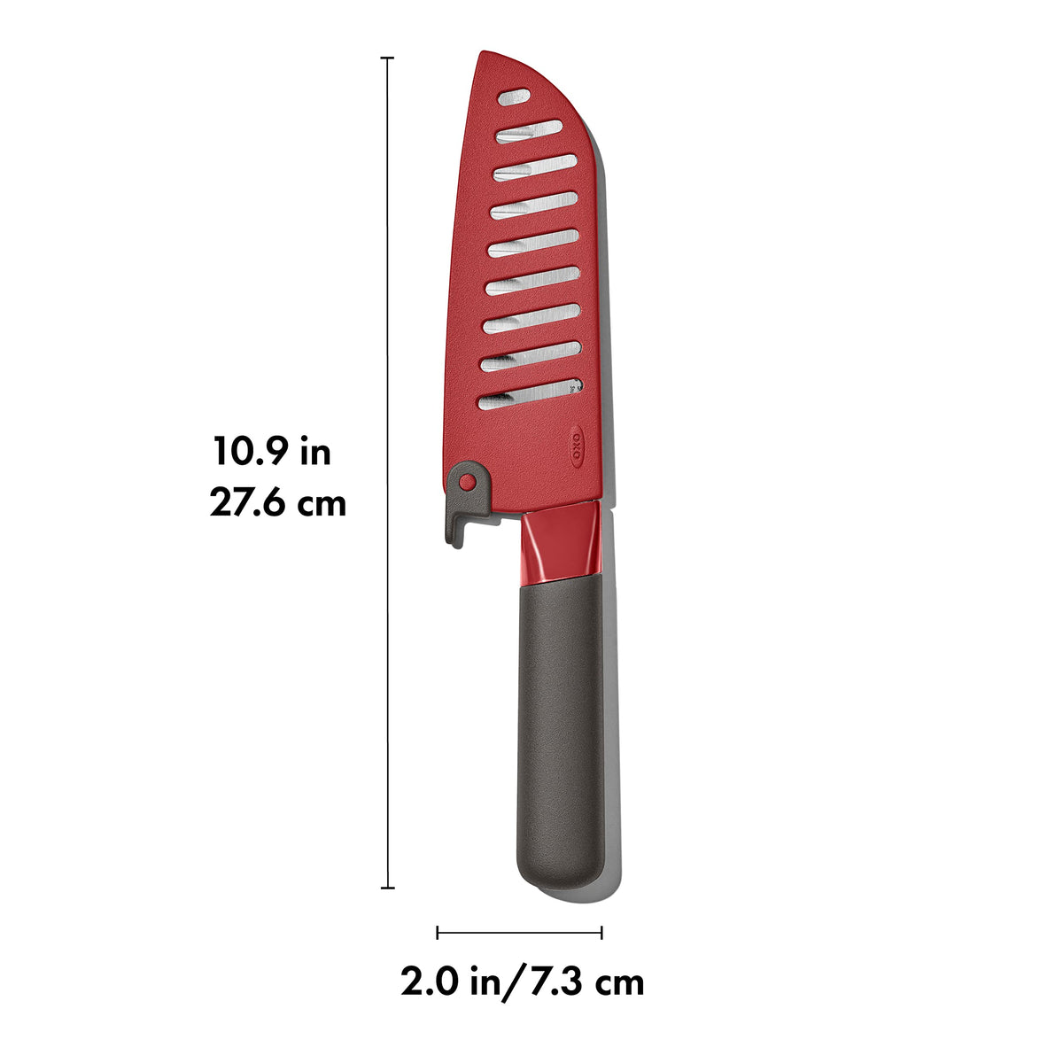 OXO Outdoor Santoku Knife on camping table ready for outdoor prep tasks.